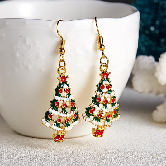 Festive earrings with Christmas tree and red balls with snow