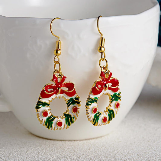 Festive earrings with festive wreaths with red bows