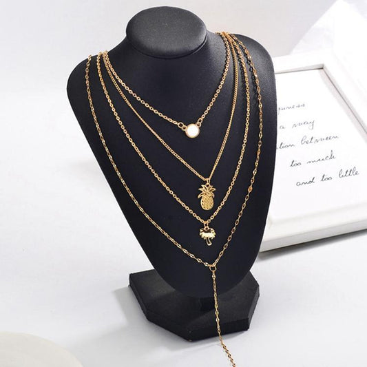 Gold-plated necklace with several chains palm pineapple