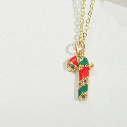 Gold-plated jewelery polka pig with bow red green candy