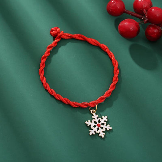 Handmade woven bracelet with Christmas motif red snow fir