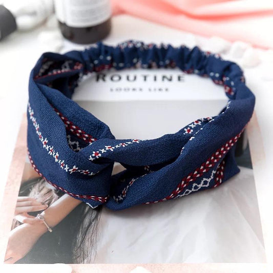 Headband with floral pattern in navy blue