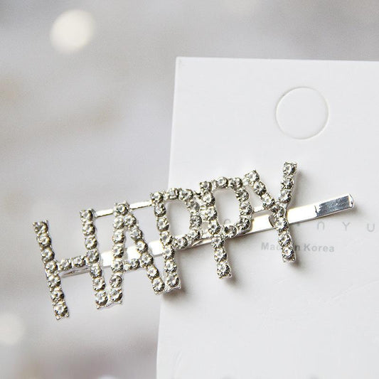 Hair pin with the word ''Happy'' in a rhinestone hair clip