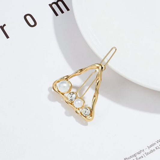 Beautiful hair clip with rhinestones and pearls in triangles