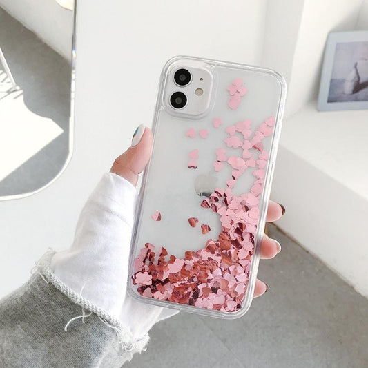 iPhone 14 Pro case with floating hearts like quicksand glitter