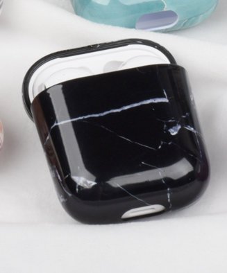 Protection for Airpods case in black with white marble pattern.