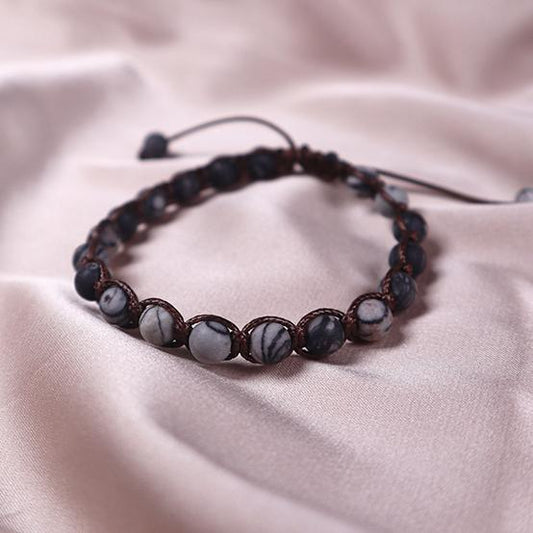 Bracelet with metamorphic limestone beads on an adjustable strap