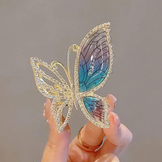 Hair clip with colorful blue butterfly in metal