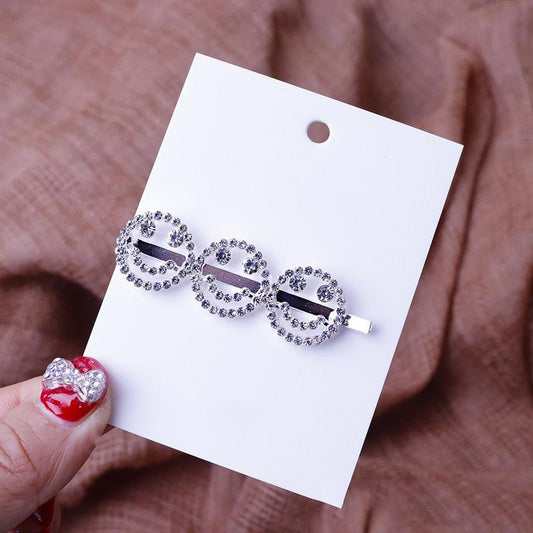 Cool hair clip with rhinestones in the shape of smilies