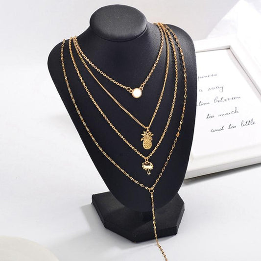 Gold-plated necklace with several chains palm pineapple