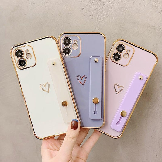 iPhone 13 Pro case with heart and ankle strap gold details