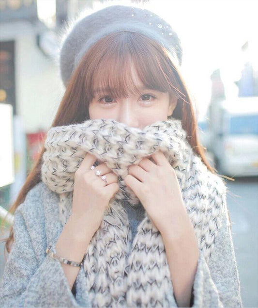 Large long fluffy scarf in warm material beautifully knitted