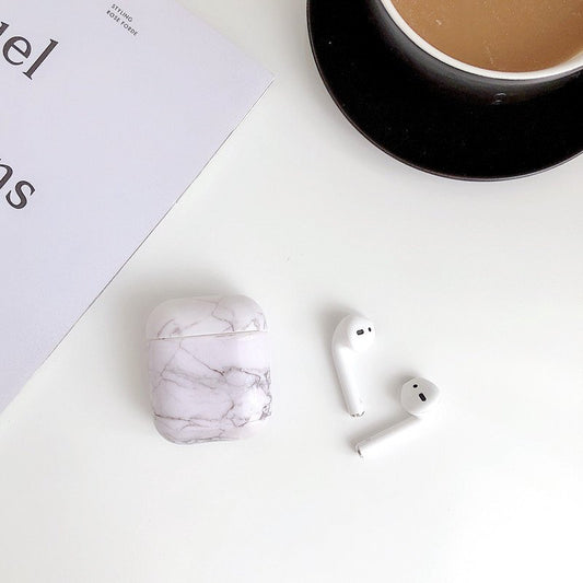 Protection for Airpods covers in white marble pattern