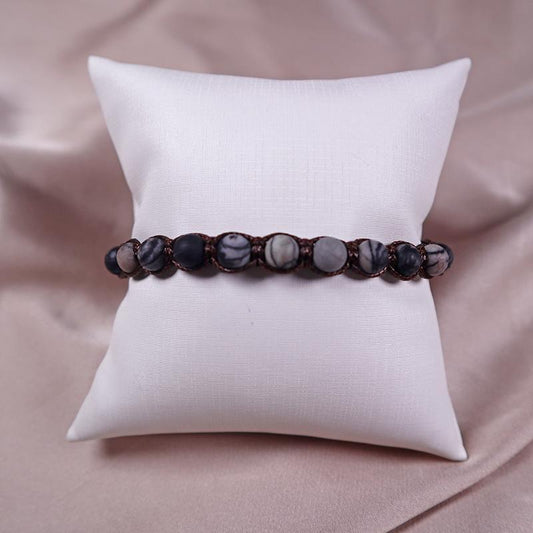 Bracelet with metamorphic limestone beads on an adjustable strap