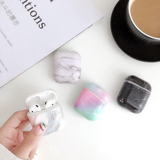 Protection for Airpods covers in white marble pattern