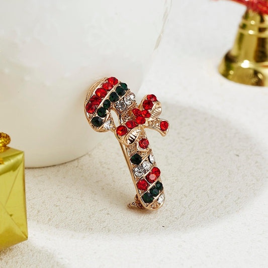 Brooch with a candy cane in rhinestones with a bow