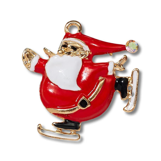 Brosch med tomte som åker skridsko guld diamant