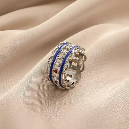 Unique ring cut out pattern with blue or red steel detail