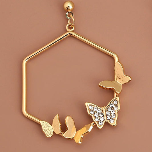 Geometric earrings in gold with butterflies and rhinestone hexagon