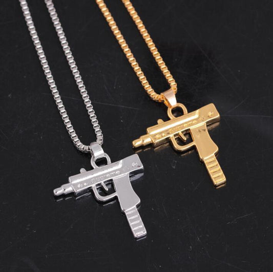 Gold plated chain with gun weapon