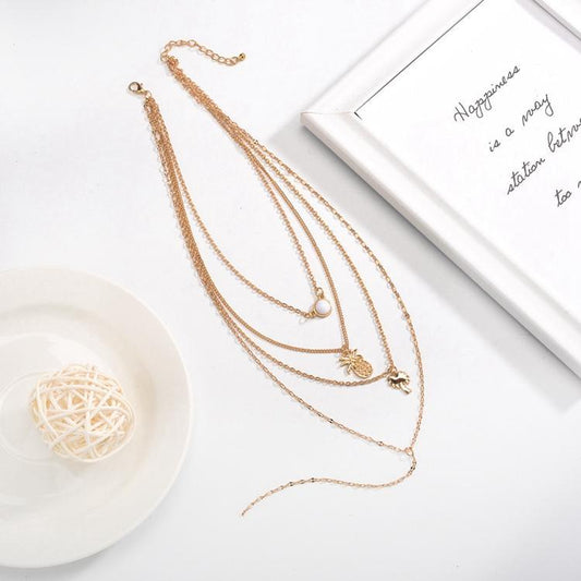 Gold-plated necklace with several chains palm pineapple