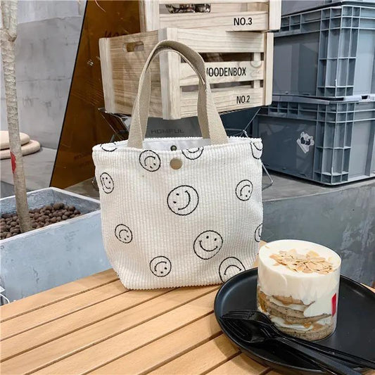 Liten tote väska i manchestertyg med glada smileys