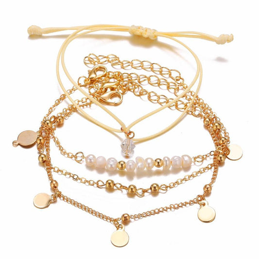 Set á 4 stk guldplaterade armband med pärlor, guld och medaljong