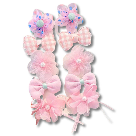 Set med färgglada rosetter hårklämmor blommor pärlor