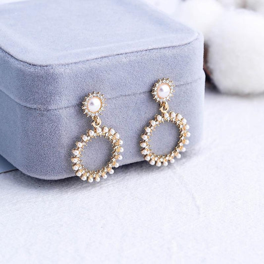 Small round earrings with pearls and rhinestones