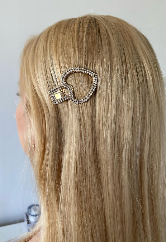 Trendy hair clip in the shape of a heart covered with glittering rhinestones