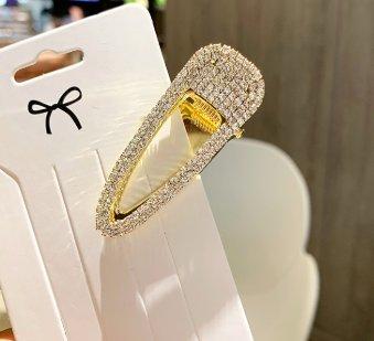 Trendig hårklämma klädd med strass som glimmar