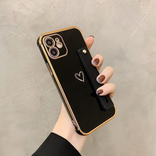 iPhone 13 skal med hjärta och vristband gulddetaljer pastell