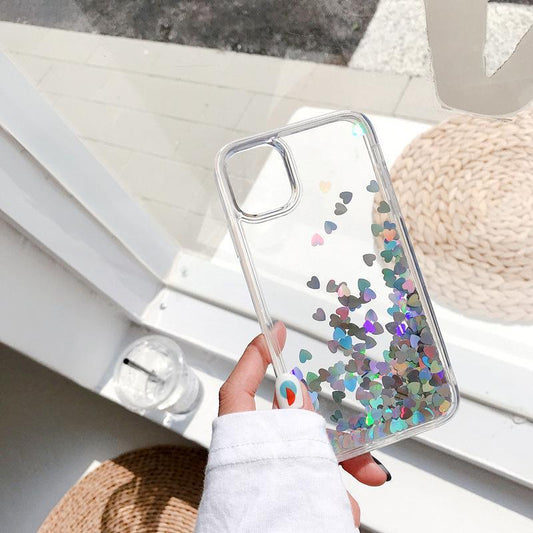 iPhone 14 case with floating hearts like quicksand glitter