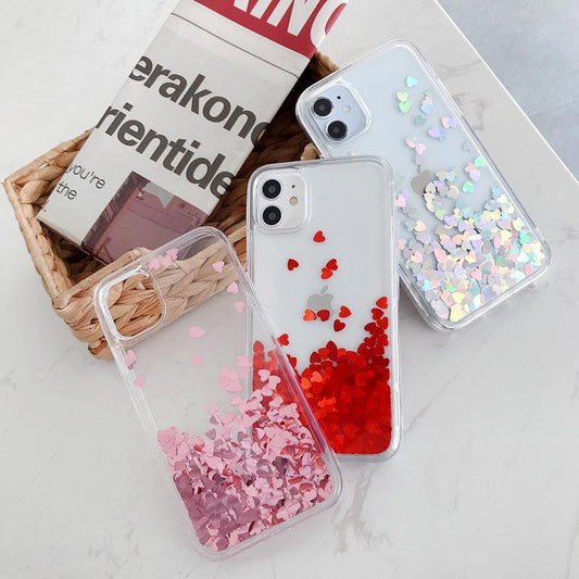 iPhone 14 case with floating hearts like quicksand glitter