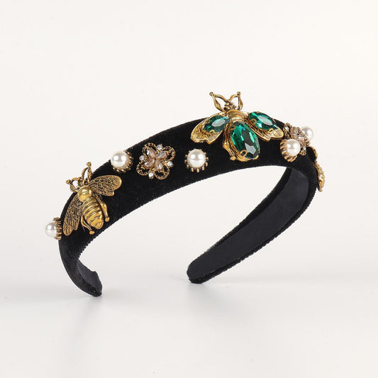 Luxurious diadem with precious stones and pearls emerald insect green black