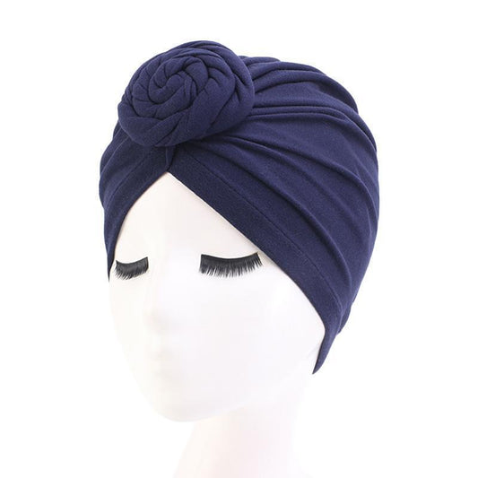 Stylish turban with bun on the front in several colors of cotton